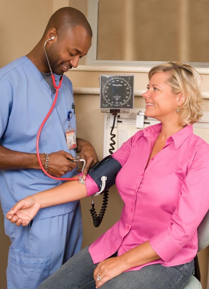 A clinician with a patient during a check-up